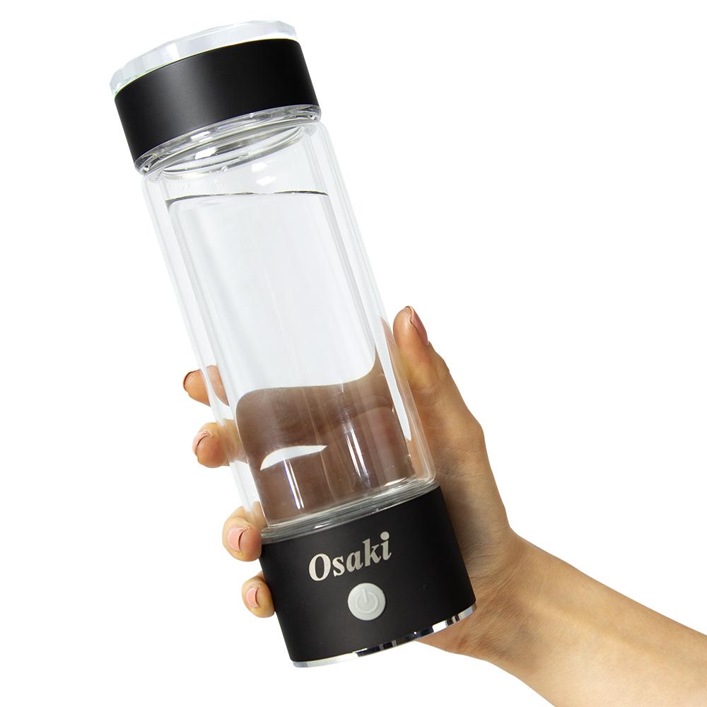 Osaki O Hydrogen Water - model holding the bottle